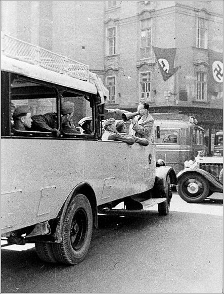 A bus transporting German soldiers on a street in Vienna